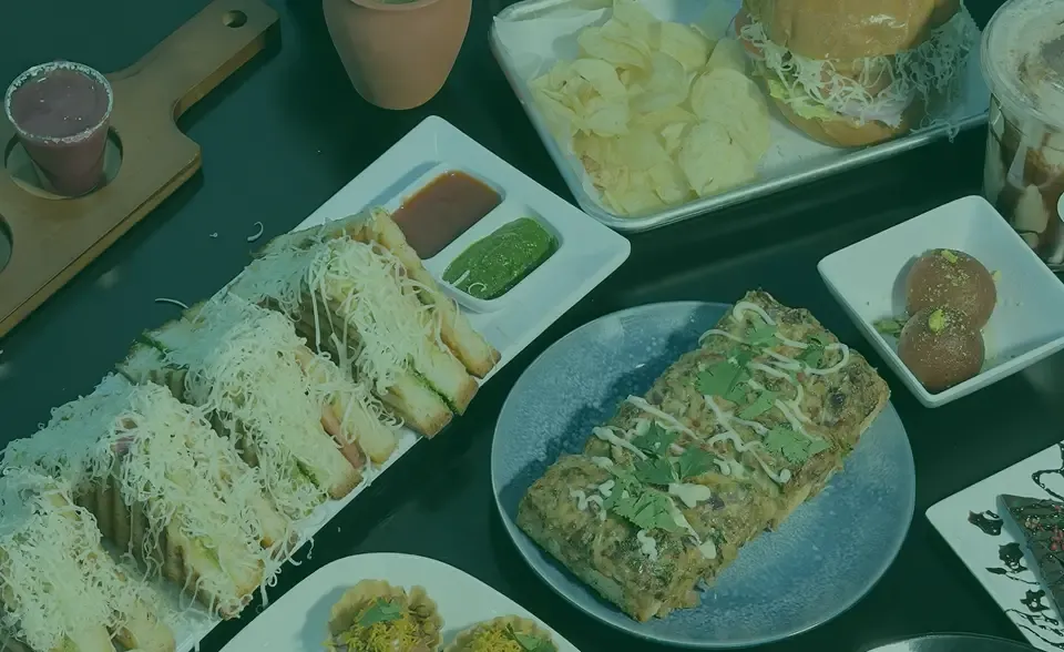 A table of Indian street food being shared